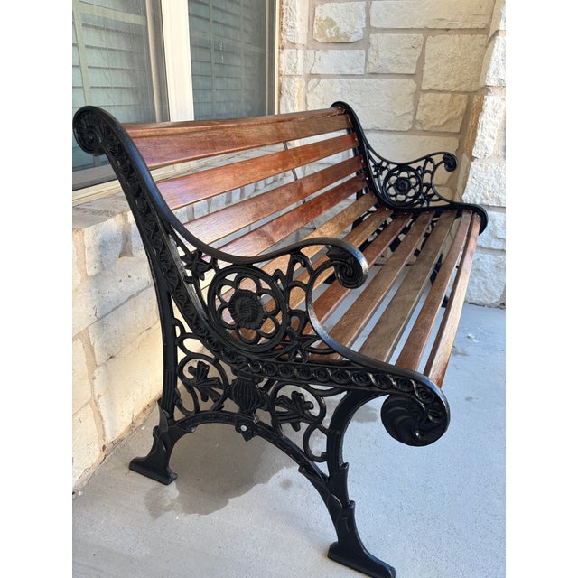 A late 1800's -early 1900's American made,Victorian style bench with cast iron arms. Cast iron arms were brushed of any...