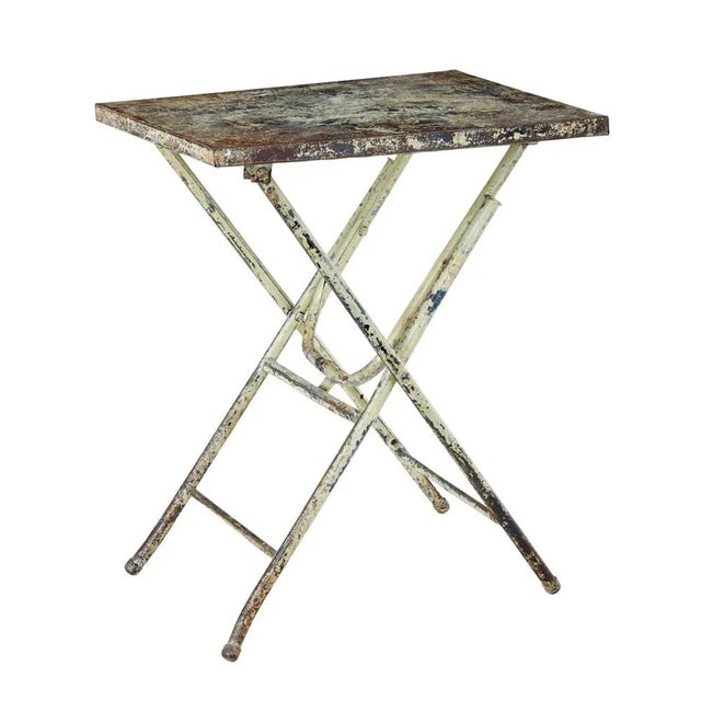 Mid century industrial folding side table circa 1960. Practical piece of everyday furniture. Metal table that folds away...