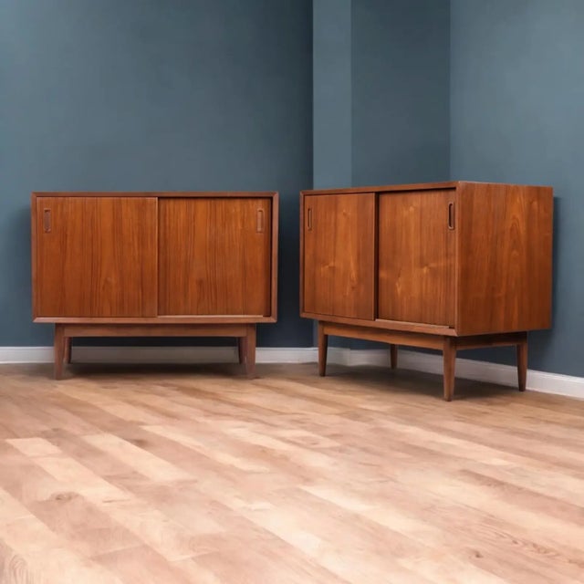 Versatile pair of modular Danish teak cabinets by Lyby. This pair of early Danish teak cabinets are part of a modular...
