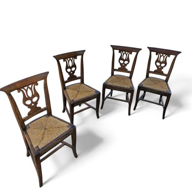 4 x elm dining chair with a carved back frame in a rosette / floral decorated / Fluted saber-curved front legs / saber-...