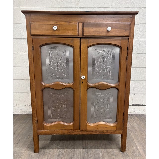 This is a stunning antique rustic French Provincial pie safe or jelly cupboard cabinet with punched tin panels. Features...