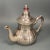 Beautiful and ornate silverplate teapot with wonderful surface character and patina. We had no luck in our research on the...