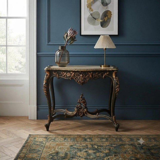 Barocchetto style table, crafted from finely carved wood, lacquered and gilded, represents a distinctive example of late...