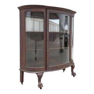 Vintage Oak Bow-Front Curved-Glass China Cabinet With Claw Feet For Sale