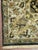 Indo Agrah rug, hand knotted in India from 100% wool. Measuring 7’9” x 10’1”, the rug features a rich dark navy field...