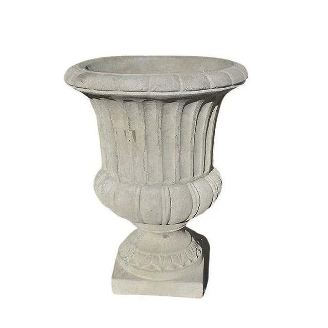 A set of two very large classical concrete planters. This set will be fabulous flanking a front door, on a patio, or in a...