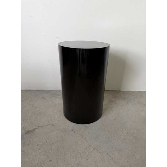 A sleek vintage Postmodern pedestal featuring a smooth cylindrical silhouette with a subtle tapered form, finished in a...