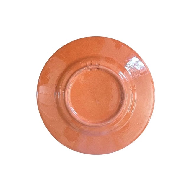 Spanish terracotta plate with bluebird design. Pie crust edges with scroll design.