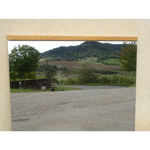 Simple, vertical mirror from the 1970s. Discreet, light oak frame with beveled corners. Compressed wood backing with two...