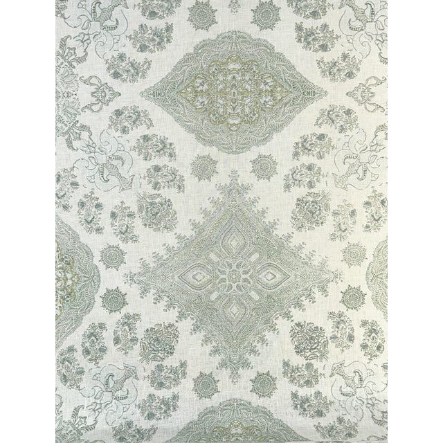 A refined medallion pattern drawn in delicate lines and printed in five soft, harmonious colors on a beautiful off-white...