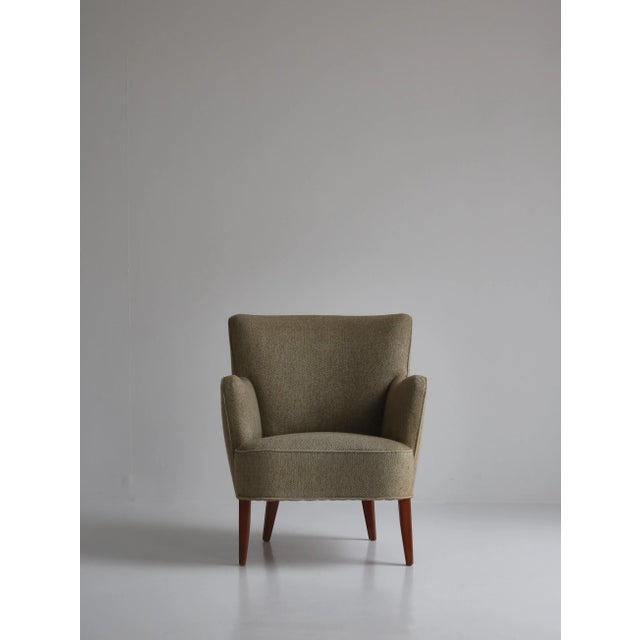 Charming vintage easy chair made in the 1950s in Denmark and attributed to Peter Hvidt & Orla Mølgaard. The chair is in...