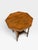 This octagonal occasional table is designed in the Victorian or Edwardian style and dates from approximately 1900....
