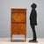 Empire-style walnut secretaire with filleting, floral inlays, and maple vases. Slightly projecting drawer under the top...