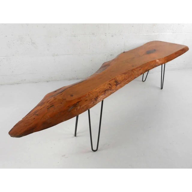 This unique free form coffee table with lacquer finish makes a wonderful addition to any rustic or modern interior, circa...