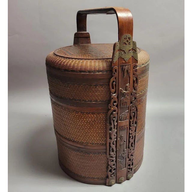 Beautifully woven with dark and light colored rattan Chinese 3-tier wedding basket with a split bamboo handle. The carved...