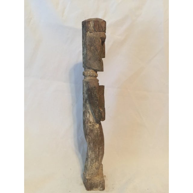 A protective figure from western Nepal. Carved in the namaste gesture of greeting and protection, these figures...