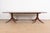 An exceptional Georgian or Regency style double pedestal extension dining table In the manner of Baker Furniture USA,...