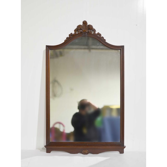 Pretty, timeless, and beautifully crafted, this Mid Century Mahogany Wall Mirror with Floral Pediment brings classic...