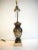 1950s églomisé lamp of classical figures. Height to finial is 38 inches.