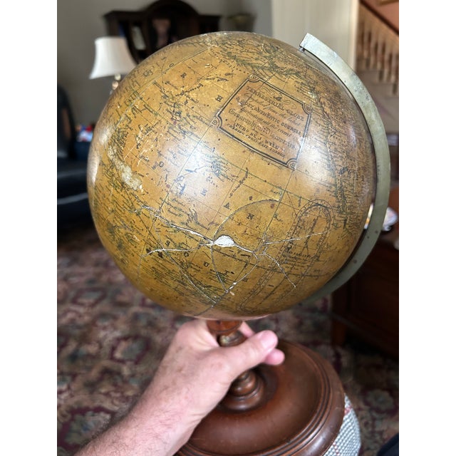 A J. Weld Terrestrial Globe. In good to fair condition. There is a slight wobble to the globe as it rests in its holder....