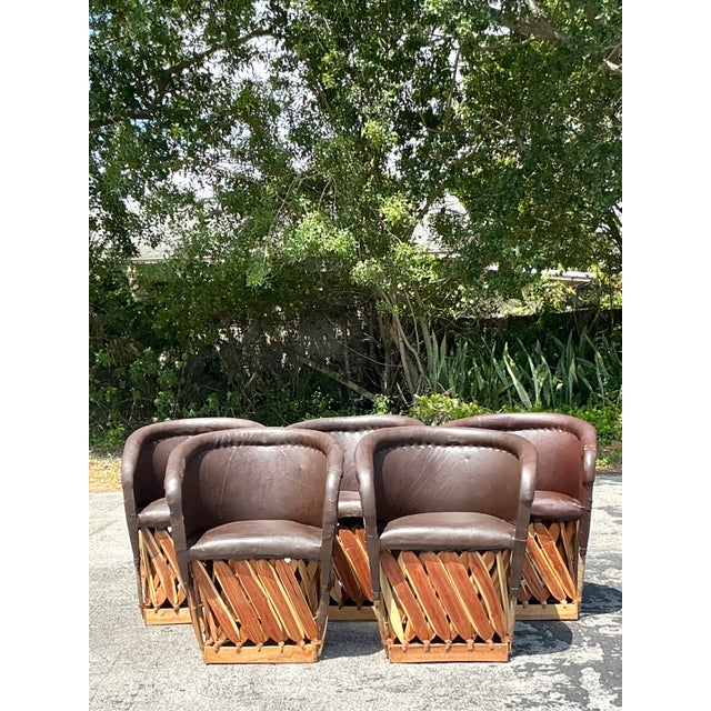 Infuse your space with rustic charm and artisanal warmth with this striking set of five Vintage Boho Equipale Chairs....