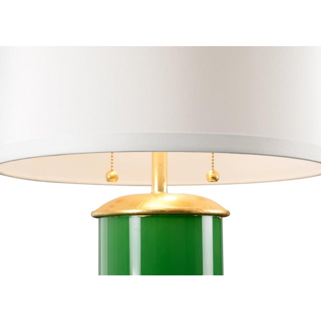 Brighten your home with this charming transitional table lamp. Savannah features a colorful glass cylinder with a dazzling...