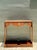 This exceptional vintage English game table embodies the functional elegance of classic campaign furniture, designed with...