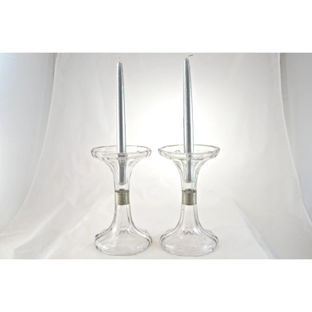 A pair of large sparkling glass Victorian era shelf risers, hat stands or candlesticks with fluted bell bodies and feet...