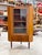 Danish Modern Corner Cabinet or Bar with glass doors. Shelves are not adjustable. 35w 22.5d 57.5h