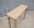 A beautifully understated antique hall table crafted from solid elmwood, dating to the late Qing dynasty. The narrow top...