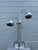 Chrome "eyeball" table lamp in the style of Sonneman. Measurements 17” W x 16” D x 25.5” H