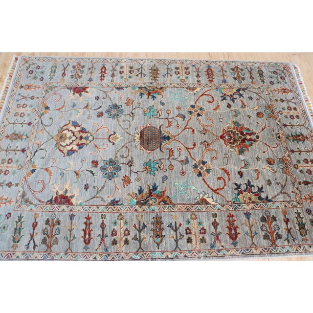 Hand-knotted Ziegler Sultanabad rug in soft grey-blue with rich floral and vine motifs in teal, rust, and ivory. Pure wool...