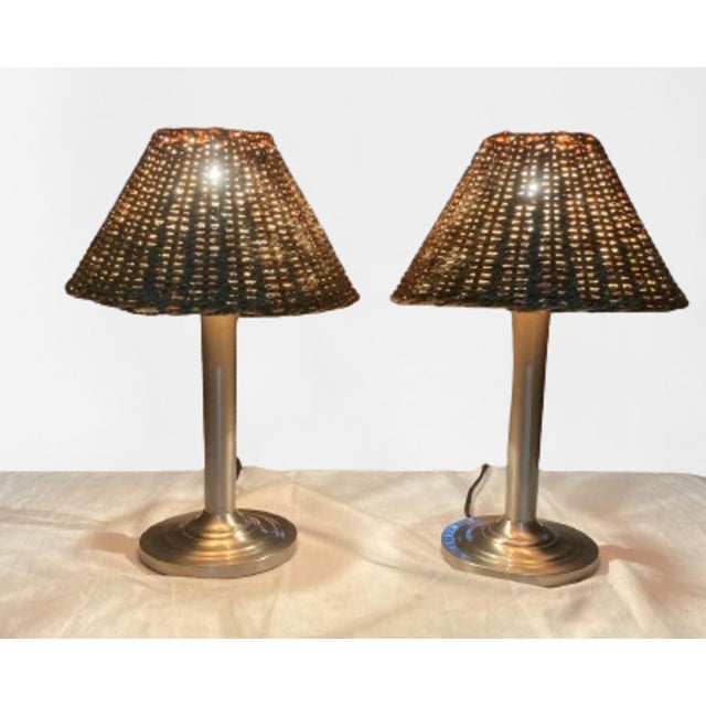 This pair of table lamps was made in the 1990s from high quality smooth cast brass with a chrome finish. The shades are...