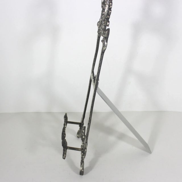 Ornate, large vintage silver metal display easel with nice patina. This is for a table top or shelf to hold a picture or...