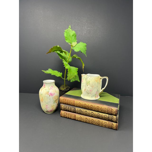 A romantic antique Royal Bayreuth Bavaria porcelain dresser set dating to circa 1900–1915, including a small vanity vase...