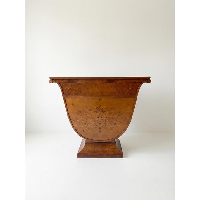 This striking Biedermeier chest dates to the early 19th century and showcases the elegance and restraint that define the...