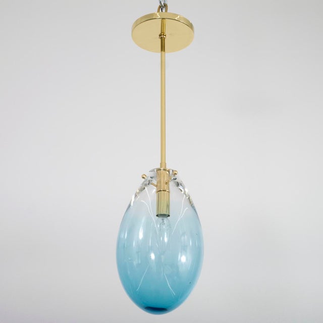 Blown blue Murano glass pendant with brass hardware.