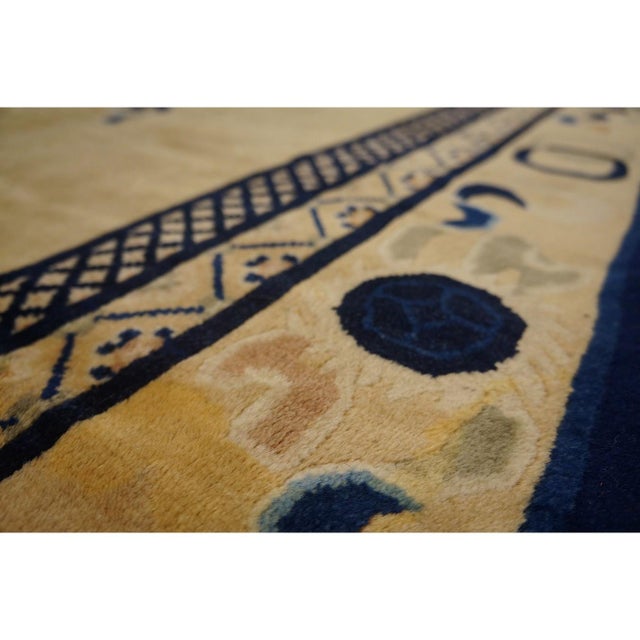 Vintage Peking Room Size Wool Blue Navy, Ivory Beige Cream White Rug, Circa Date: 1980s. This elegant example of Chinese...