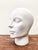 Elegant white Ceramic statue of a head in a stylish design. Made in the 1970s by the Dutch company Royal Delft. These...