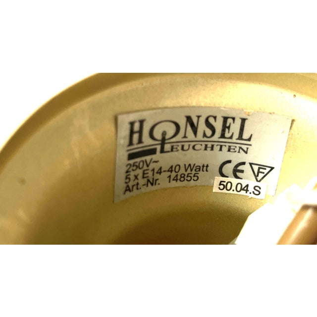 Elegant vintage five-light chandelier by honsel leuchten, germany, featuring a refined polished brass structure with five...