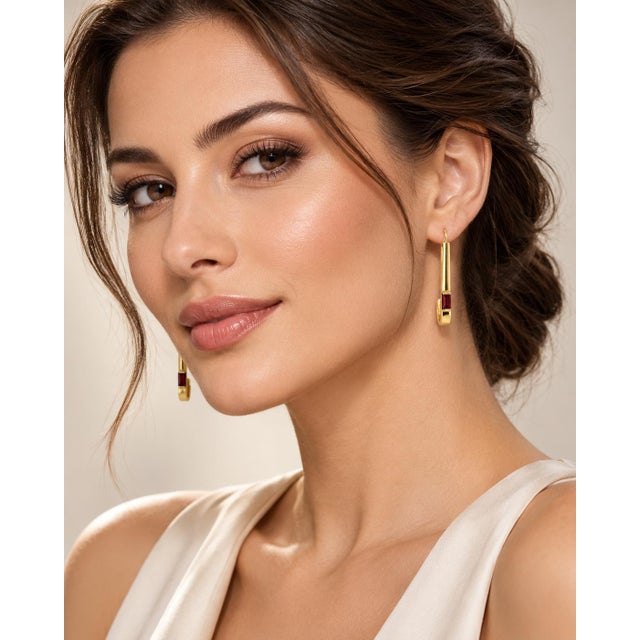 A sleek and modern vintage design expertly crafted in solid 14k yellow gold. Featuring elongated, paperclip-inspired...