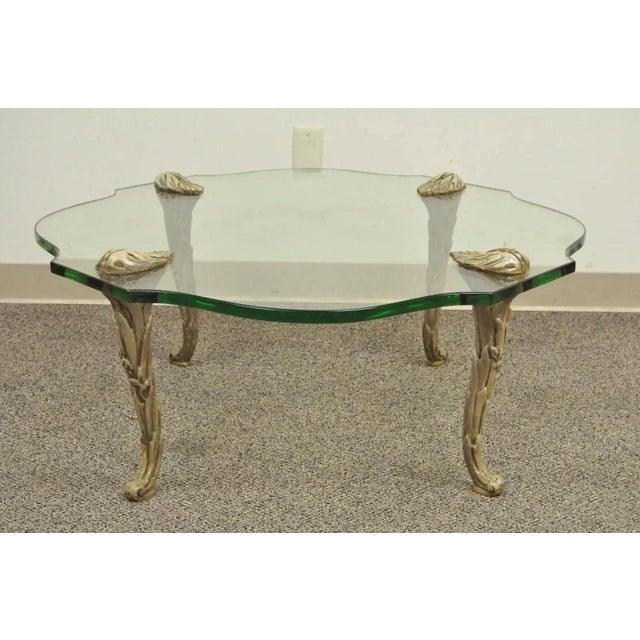 Vintage Hollywood Regency Carved Wood Faux Bois Legs Glass Top Coffee Table. Item features 3/4" thick shaped glass top,...