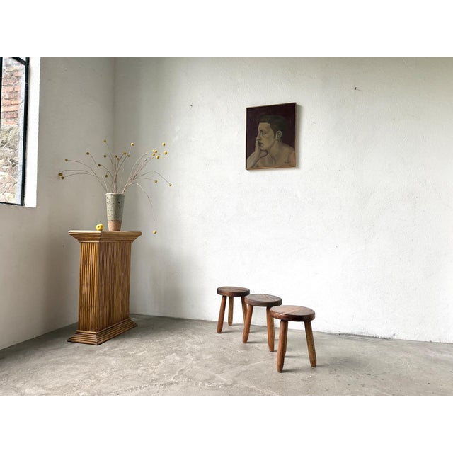 Maison Lecan presents this set of three tripod stools from the 1960s, crafted from beechwood. These low, handcrafted...