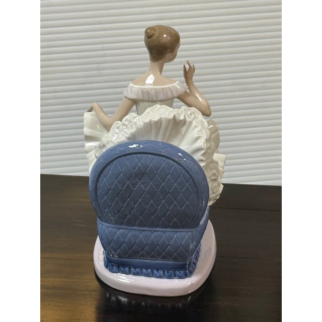 Design Plus Gallery presents the Porcelain Figurine of Sitting Ballerina in Plush Blue Chair from the Tribute to a...