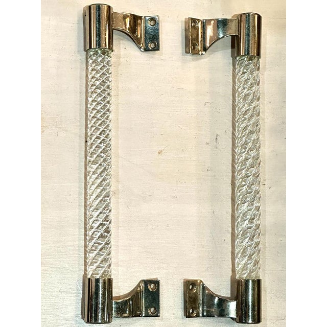 Pair of elongated 1950's Murano push and pull handles in twisted clear glass set in chrome fittings, by Ercole Barovier...