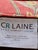 Custom Cr Laine Coral Botanical Cocktail Ottoman | Luxury Designer Upholstered Coffee Table Ottoman With Turned Wood Legs & Brass Casters For Sale - Image 11 of 11