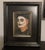 This oil painting presents a striking portrait of a figure adorned with traditional Day of the Dead face paint, capturing...