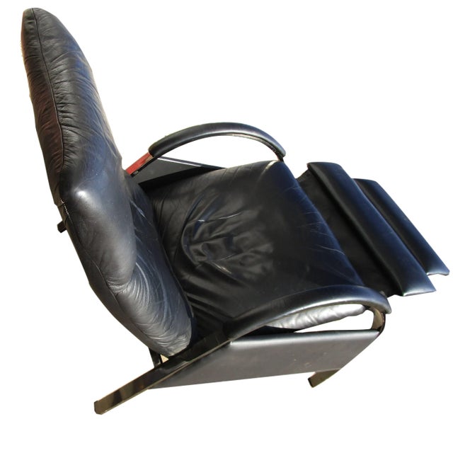 Three position reclining leather lounge armchair with swing out foot rest designed in the style of Milo Baughman for...