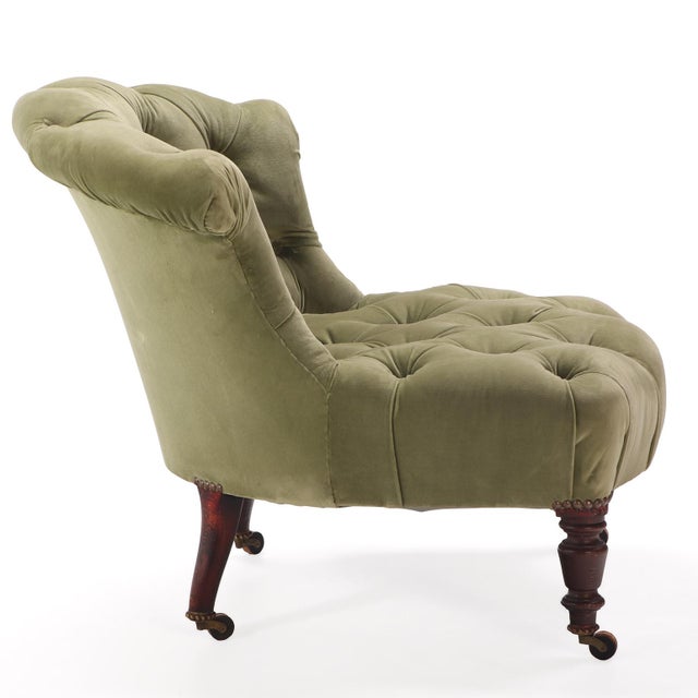 An elegant French Napoleon III boudoir chair featuring a gracefully shaped upholstered back and seat (lovely clean fabric)...