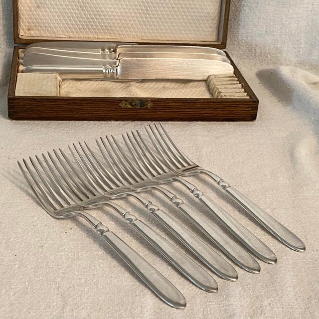 Set of 12 includes 6 knives and the measurement are 9 1/2 inch long X 7/8 inches wide and 6 forks at 7 1/4 long X 7/8...